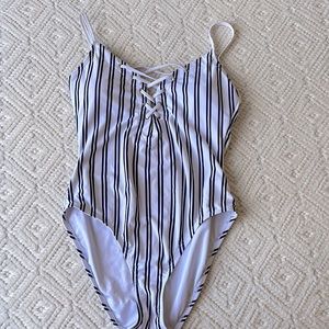 White and navy striped one piece women’s swim suit, size XL
